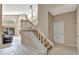 Light-filled entryway with tiled floors, staircase, and access to the living area at 1039 Eagles Forrest Dr, Apopka, FL 32712