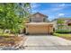 Charming two-story home with a stone-accented front, a two-car garage, and a well-manicured lawn at 1039 Eagles Forrest Dr, Apopka, FL 32712