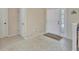 Bright foyer featuring tile flooring, a white front door with decorative glass, and neutral wall paint at 1039 Eagles Forrest Dr, Apopka, FL 32712