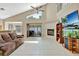 Open living room featuring a fireplace, sliding glass doors, a staircase, and lots of natural light at 1039 Eagles Forrest Dr, Apopka, FL 32712