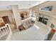 Bright, open-concept living area showcasing high ceilings, kitchen view, and seamless flow to the outdoors at 1039 Eagles Forrest Dr, Apopka, FL 32712