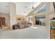Bright living room with tiled floors, vaulted ceilings and sliding glass doors to backyard at 1039 Eagles Forrest Dr, Apopka, FL 32712