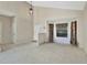 Bright living room featuring neutral walls, tile flooring, and a window with patterned curtains at 1039 Eagles Forrest Dr, Apopka, FL 32712
