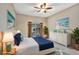 Bedroom with blue accents, dresser, and slider leading to backyard at 1039 Eagles Forrest Dr, Apopka, FL 32712
