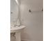 Pedestal sink with a white wall and neutral plumbing fixtures providing an essential, clean bathroom area at 1128 Travertine Ter, Sanford, FL 32771