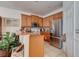 Kitchen boasts stainless steel appliances, breakfast bar, light wood cabinetry and ceramic tile at 1128 Travertine Ter, Sanford, FL 32771