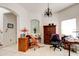 A dedicated office space is filled with natural light and features a ceiling fan at 1128 Travertine Ter, Sanford, FL 32771