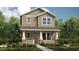 Charming two-story home boasts a welcoming front porch with stone accents and a well-manicured lawn at 12821 Harvest Rain Ave, Winter Garden, FL 34787