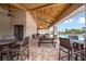 Outdoor seating area near the pool with tables and chairs, perfect for community gatherings at 12821 Harvest Rain Ave, Winter Garden, FL 34787