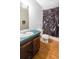 Bathroom with a toilet and sink with a dog-themed shower curtain at 13010 Plum Lake Cir, Minneola, FL 34715