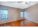 Bright bedroom with hardwood floors and windows that provide natural light at 13010 Plum Lake Cir, Minneola, FL 34715