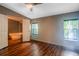 Spacious main bedroom with hardwood flooring and an ensuite bathroom at 13010 Plum Lake Cir, Minneola, FL 34715