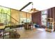 Sunroom featuring many windows providing natural light, a table and chairs at 13010 Plum Lake Cir, Minneola, FL 34715