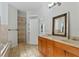 Dual sink bathroom with tile floors, walk in shower, and large vanity at 1309 W Yale St, Orlando, FL 32804