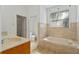 Bathroom features a soaking tub, tiled floors, and a separate toilet room at 1309 W Yale St, Orlando, FL 32804