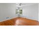Cozy bedroom with hardwood floors and a bright window at 1309 W Yale St, Orlando, FL 32804