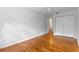 Bright bedroom featuring hardwood floors, ceiling fan, and closet space at 1309 W Yale St, Orlando, FL 32804