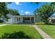 Charming single-story home with a well-manicured lawn and inviting front porch at 1309 W Yale St, Orlando, FL 32804