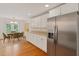 Bright kitchen with stainless steel refrigerator and adjacent dining area at 1309 W Yale St, Orlando, FL 32804