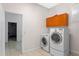Laundry room featuring cabinetry, tile floors, and a window at 1309 W Yale St, Orlando, FL 32804