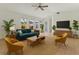 Sunlit living room features contemporary furniture, neutral tones, and large windows for natural light at 1309 W Yale St, Orlando, FL 32804