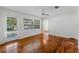 Bright living room with hardwood floors, a ceiling fan, and large windows at 1309 W Yale St, Orlando, FL 32804