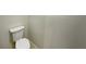 Close-up view of the toilet in the bathroom with white walls at 13108 Long Pine Trl, Clermont, FL 34711