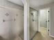 Shower stall with glass door and tiled walls offers easy access to the rest of the bathroom at 13108 Long Pine Trl, Clermont, FL 34711
