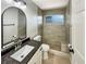 Updated bathroom with tiled shower, granite countertop, and modern fixtures at 13108 Long Pine Trl, Clermont, FL 34711