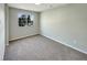 Neutral bedroom with carpet, a window providing natural light, and electrical outlets at 13108 Long Pine Trl, Clermont, FL 34711