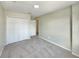 Empty bedroom with carpet flooring, a double closet, and neutral tones at 13108 Long Pine Trl, Clermont, FL 34711