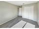 Neutral bedroom featuring gray carpet, a closet, and a door to an adjoining room at 13108 Long Pine Trl, Clermont, FL 34711