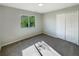 Cozy bedroom featuring gray carpet, a window with a view, and a double-door closet at 13108 Long Pine Trl, Clermont, FL 34711