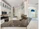 Modern kitchen with granite countertops, stainless steel appliances, and an open layout for easy entertaining at 13108 Long Pine Trl, Clermont, FL 34711