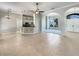 Spacious living room featuring tile flooring, neutral tones, and arched doorways at 13108 Long Pine Trl, Clermont, FL 34711