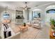 Open-concept living room featuring tile flooring, neutral tones, and lots of natural light at 13108 Long Pine Trl, Clermont, FL 34711