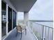 Enjoy panoramic views of the water from this private balcony with outdoor seating at 13427 Blue Heron Dr # 2-1401, Orlando, FL 32821