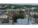 Sweeping city view from a high-rise balcony, overlooking lush landscapes and neighborhood amenities at 13427 Blue Heron Dr # 2-1401, Orlando, FL 32821