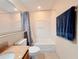 Clean bathroom featuring tub, vanity, and toilet at 13427 Blue Heron Dr # 2-1401, Orlando, FL 32821
