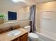 Bathroom vanity with granite countertop and tub at 13427 Blue Heron Dr # 2-1401, Orlando, FL 32821