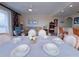 Cozy dining area featuring an open concept with an island bar and comfortable living room at 13427 Blue Heron Dr # 2-1401, Orlando, FL 32821