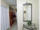 Hallway with bunk beds, decorative mirror, and entry door at 13427 Blue Heron Dr # 2-1401, Orlando, FL 32821