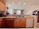 Modern kitchen with granite countertops, stainless steel appliances, and breakfast bar at 13427 Blue Heron Dr # 2-1401, Orlando, FL 32821