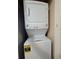 White stacked washer and dryer with easy-to-use controls at 13427 Blue Heron Dr # 2-1401, Orlando, FL 32821