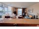 Bright and open living room with dining area and access to a balcony with a beautiful view at 13427 Blue Heron Dr # 2-1401, Orlando, FL 32821