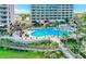 Beautiful community pool with chairs, cabana and boardwalk access to the complex at 13427 Blue Heron Dr # 2-1401, Orlando, FL 32821