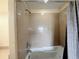 Tiled shower with tub and showerhead fixture at 13427 Blue Heron Dr # 2-1401, Orlando, FL 32821