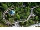 Elevated walkway through a preserve with shade and park benches at 13427 Blue Heron Dr # 2-1401, Orlando, FL 32821