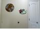 Wall decor with wooden map and tropical paradise sign near a white door at 13427 Blue Heron Dr # 2-1401, Orlando, FL 32821
