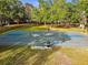Outdoor basketball court with hoops, benches, and shaded picnic area, perfect for community recreation at 145 Lakeside Cir, Sanford, FL 32773